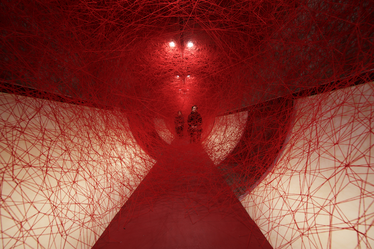 Chiharu Shiota 10 Lifelines, 2019 | Performance/Installation: red wool, wooden chairs | Kulturprojekte Berlin, Germany | Photo Sunhi Mang | Copyright VG Bild-Kunst, Bonn, 2019 and the artist