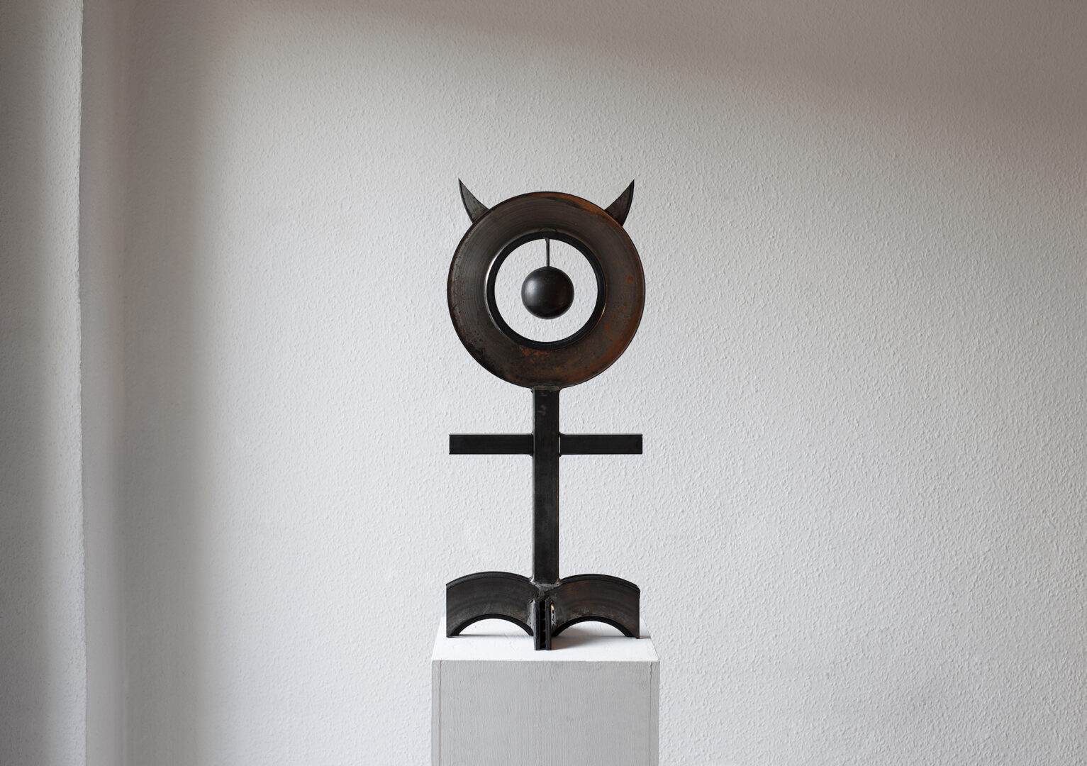 GØNEJA ✷ 6 Gøneja* Spirit Monad, (2021),Totemic adaptation of an ancient esoteric symbol made with discharged automobile brakes and steel tubes, Cast iron & steel, 79 x 29 x 19 cm