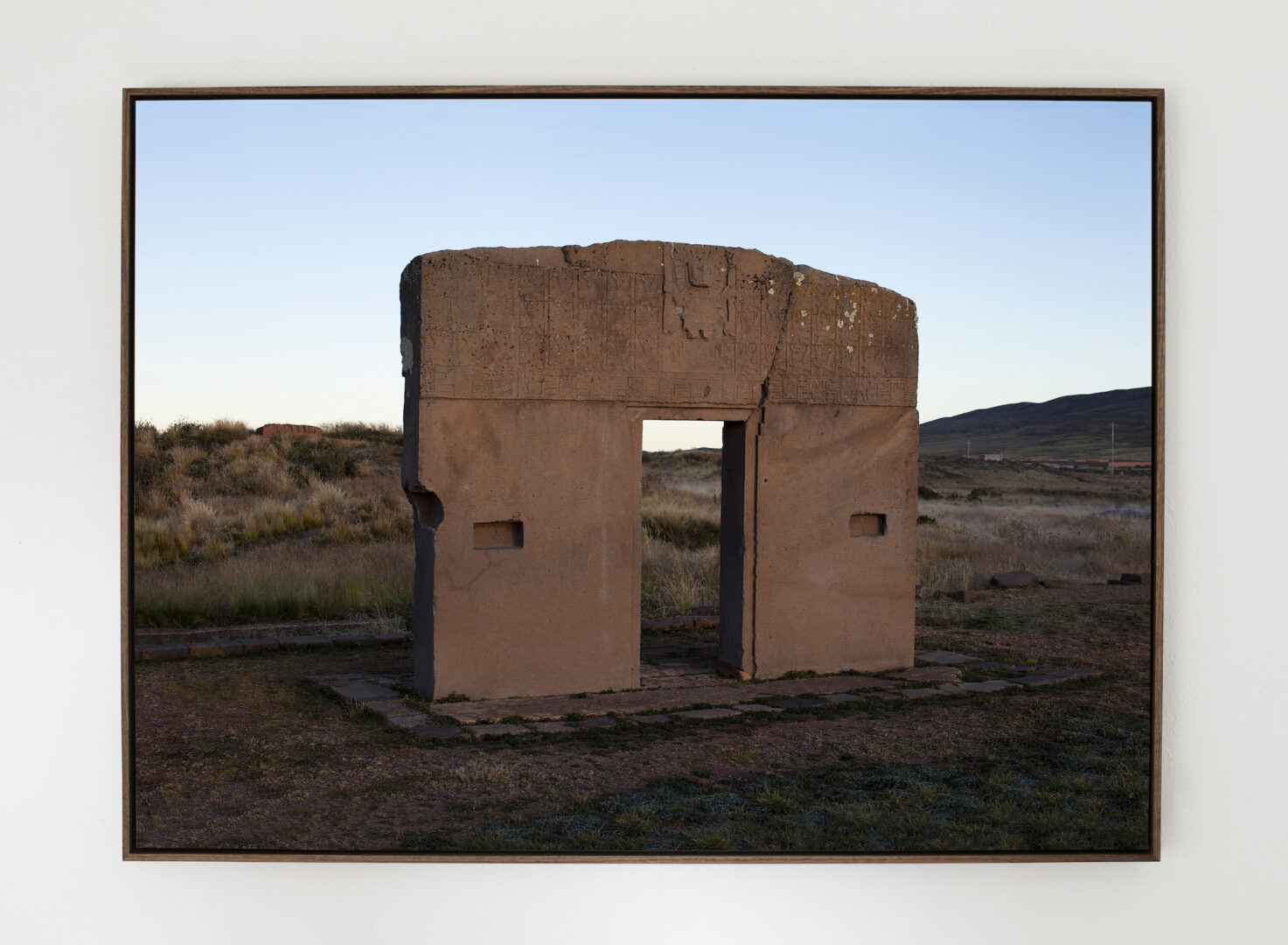 GØNEJA ✷ 5 Gate of the Sun (2022), inkjet print on plate, shadow-box frame, 77 x 106 x 5 cm | The mysterious monolithic gateway standing in the ancient archaeological site of Tiwanaku in Bolivia.